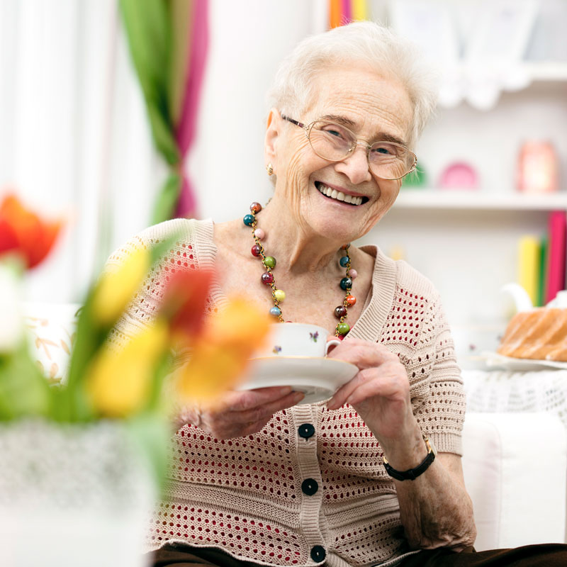 Senior woman drinking tea in her apartment